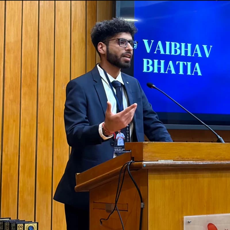 Vaibhav Bhatia speaking at a podium